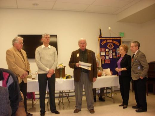 New Lions John McCloskey and Carole Derrick are inducted by Past District Governor Bill Thomas